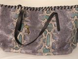 a close up of a purse with a zipper on it