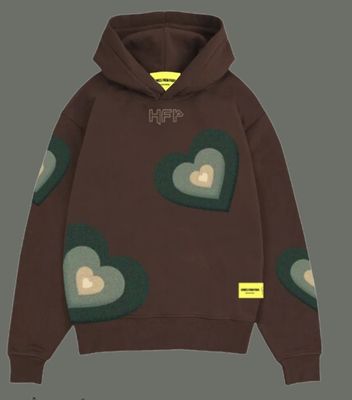 a brown hoodie with hearts on it and a yellow tag on the chest