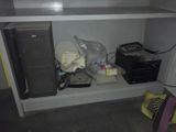 a small cabinet with a lot of stuff on it