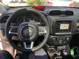 dashboard view of a car with a steering wheel and dashboard controls