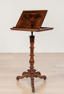 an old wooden table with a laptop on top of it
