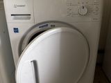 a washing machine and a dryer sitting next to each other