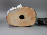a piece of wood that has a hole in it