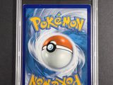 a close up of a card with a pokemon ball on it