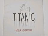 a sign that says titanic on the side of a building