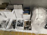 many boxes of assorted items sitting on a shelf