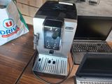 two laptops and a coffee maker on a table