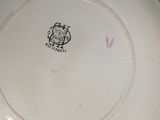 a white plate with a black and white design on it