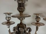 a silver candelier that is sitting on a table