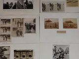 many pictures on the wall of a room with pictures on the wall