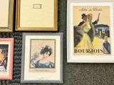 many framed pictures on the floor of a room