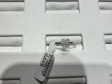 a remote control sitting on top of a white box