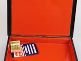 a red box with a card and a wallet inside of it