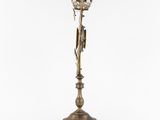 an antique brass candle holder with a clock on top of it