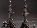 pair of antique cast iron candlesticks in the manner of person