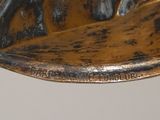 a close up of a wooden bowl with a horse on it