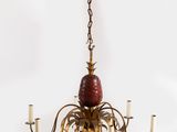 an image of a chandelier with a pineapple hanging from the ceiling