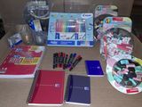 a table that has a lot of school supplies on it