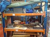 a large rack with many items on it in a warehouse