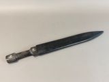 a knife that is laying on a white surface