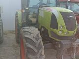 a tractor that is parked next to other tractors