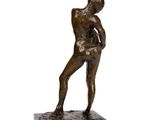 bronze statue of a man holding a baseball bat on a marble base