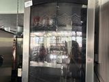 a silver refrigerator with a glass door inside of it