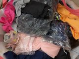 a suitcase full of clothes and a pair of shoes