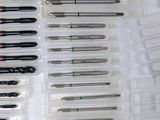 a lot of different types of screws in a box