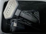 a black box with a charger and some wires in it