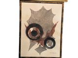 framed picture of a painting of a leaf and a pair of eyes
