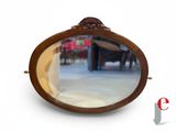 a mirror that is sitting on the floor in front of a table