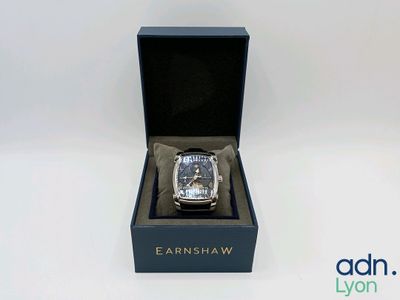 an image of a watch in a black box on a white surface