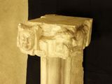 a close up of a stone pillar with a black background