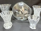 three glass vases sitting next to each other on a table