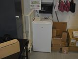 a small room with a refrigerator and a refrigerator freezer in it