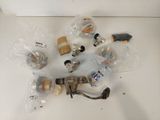a lot of different types of valves and fittings on the table