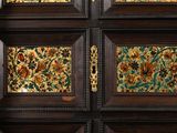 four panels of wood with floral designs on them