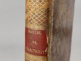 an old book sitting on top of a wooden table