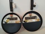 two pans that are sitting on a table