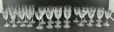 a lot of wine glasses sitting on a table