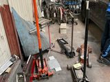 two men working on a car in a garage