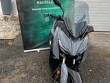 a black motorcycle parked in front of a building