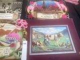 a picture of a table with a picture of a farm scene on it