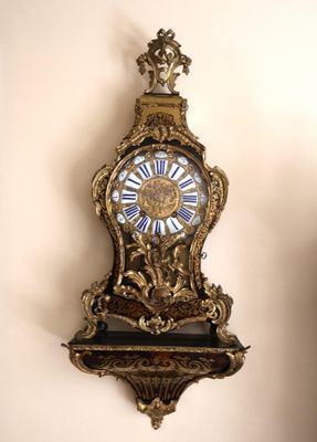 a clock that is hanging on the wall in the room
