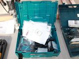 a green tool box filled with assorted items on a table