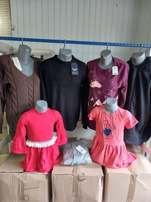 several mannequins and dresses are on display in a room