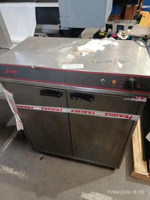 an image of a commercial dishwasher in a warehouse