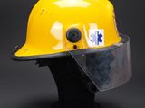 a close up of a yellow hard hat on a black mannequin head