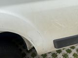 a white truck parked on the side of the road